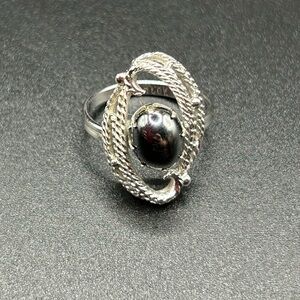 1970s Sarah Coventry faux hematite cabochon silver-tone, adjustable setting.